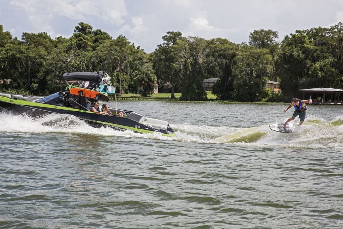 Wakesurfing behind a wakeboard boa